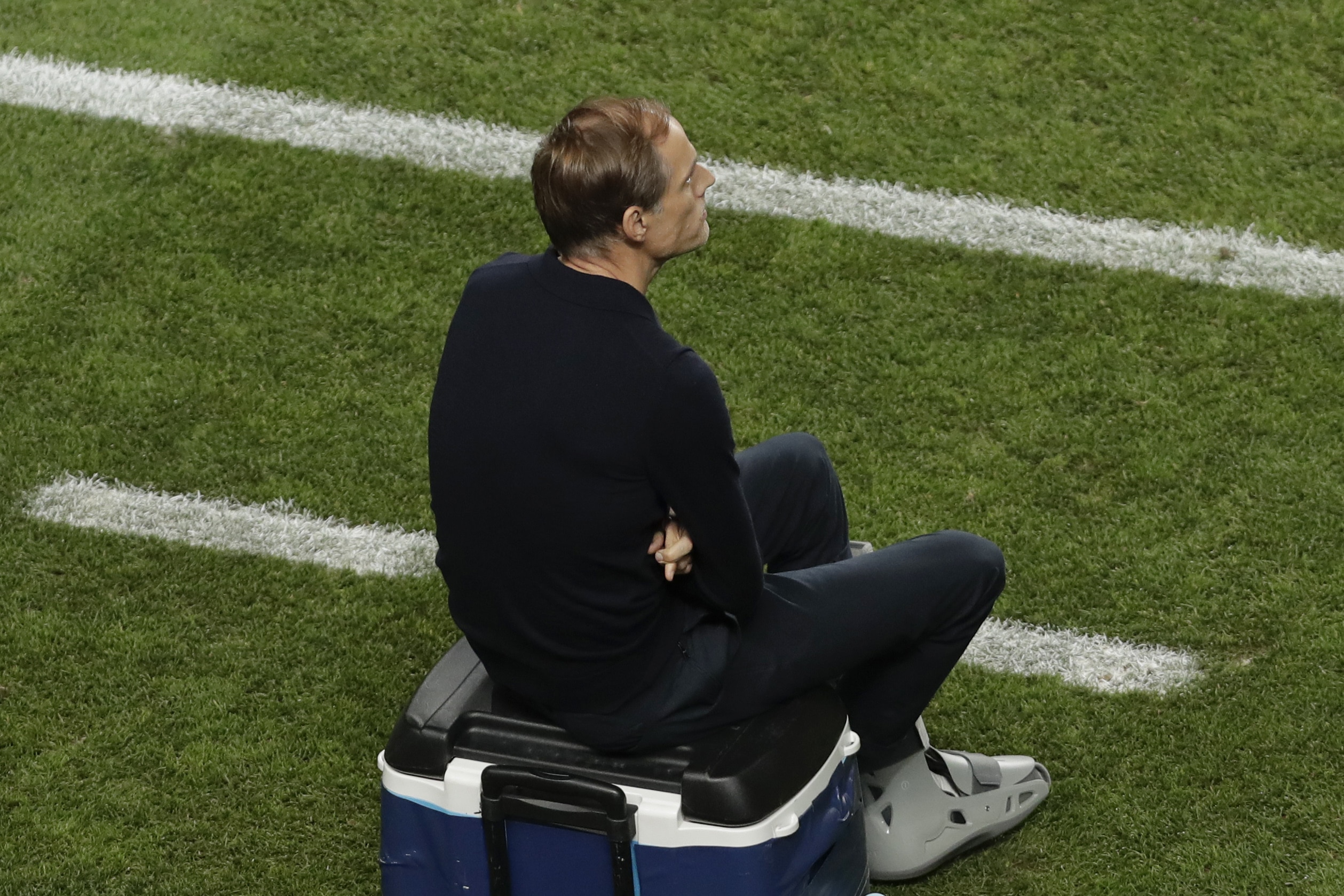 Paris Saint-Germain's German coach Thomas Tuchel sits on a cooler in the coach's area within the UEFA Champions League final football match between Paris Saint-Germain and Bayern Munich at the Luz stadium in Lisbon on August 23, 2020. (Photo by Manu Fernandez / POOL / AFP)